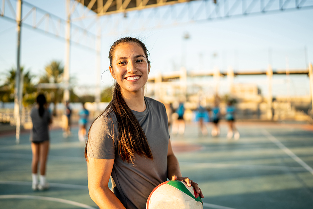 image of women playing basketball